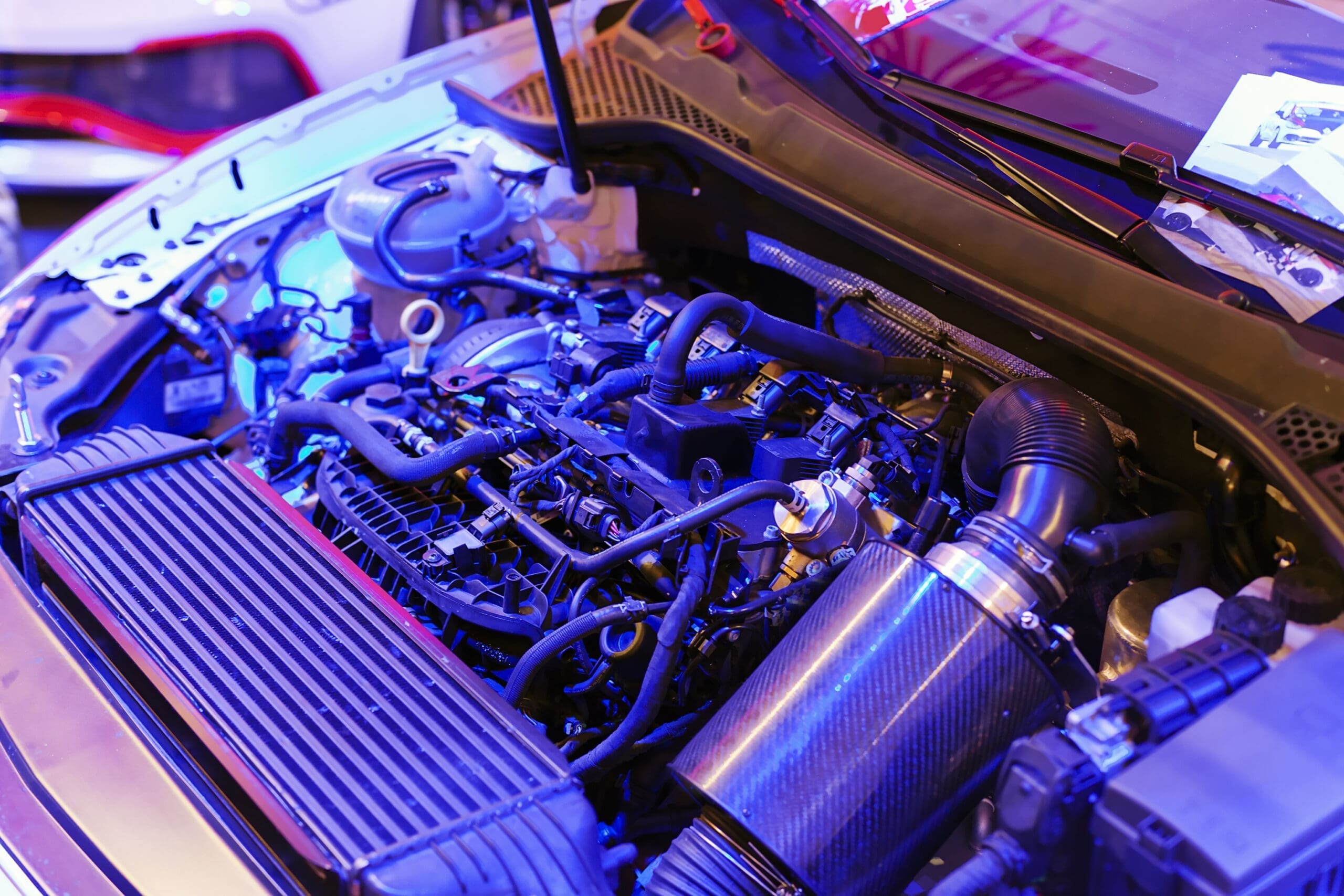 part-of-car-engine-on-neon-light-note-shallow-dep-2026-03-26-07-29-52-utc